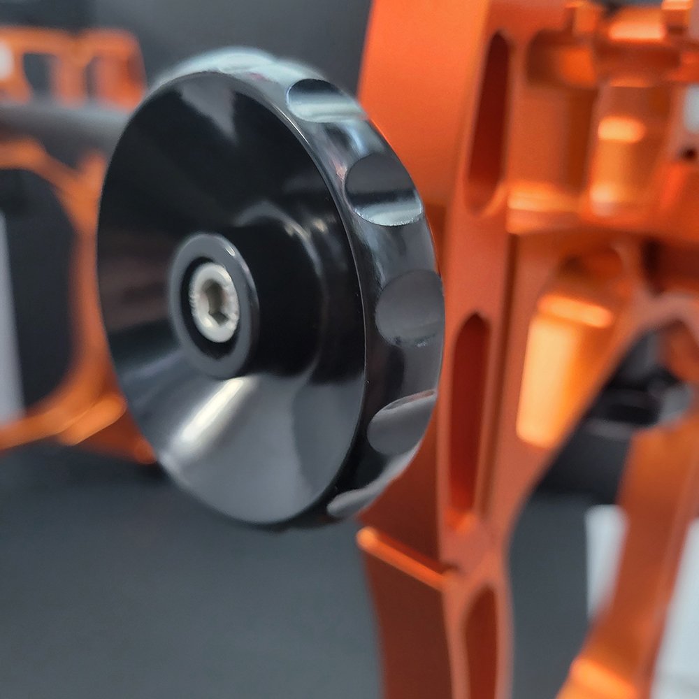 Skate-Tec Pro Jig – close-up of black tension knob on orange aluminium frame